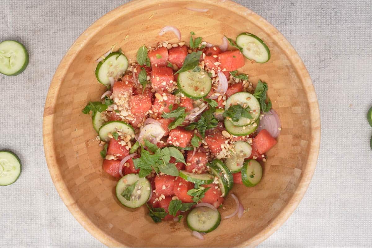 Roasted crushed peanuts, mint and Thai basil sprinkled over ready Thai watermelon salad.