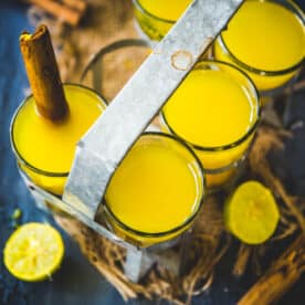 Turmeric ginger tea served in glasses.