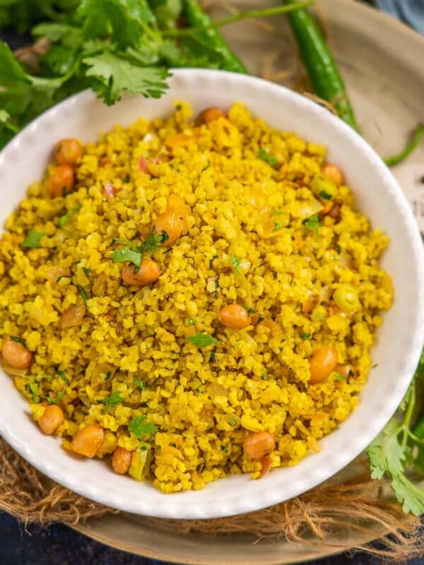 Millet Poha is a healthy take on the regular poha recipe where the poha (flattened rice) is replaced with flattened millet. It is perfect to serve for breakfast or evening snacks (vegan, gluten-free).