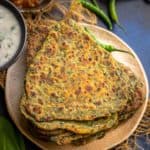 Palak Paratha (Spinach Paratha) is an unleavened Indian flatbread made using whole wheat flour, spinach and mild spices. It can be served for breakfast, lunch or dinner. Try it!
