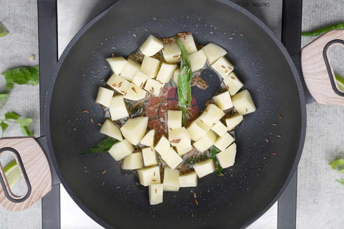 Cubed potato added to the pan.