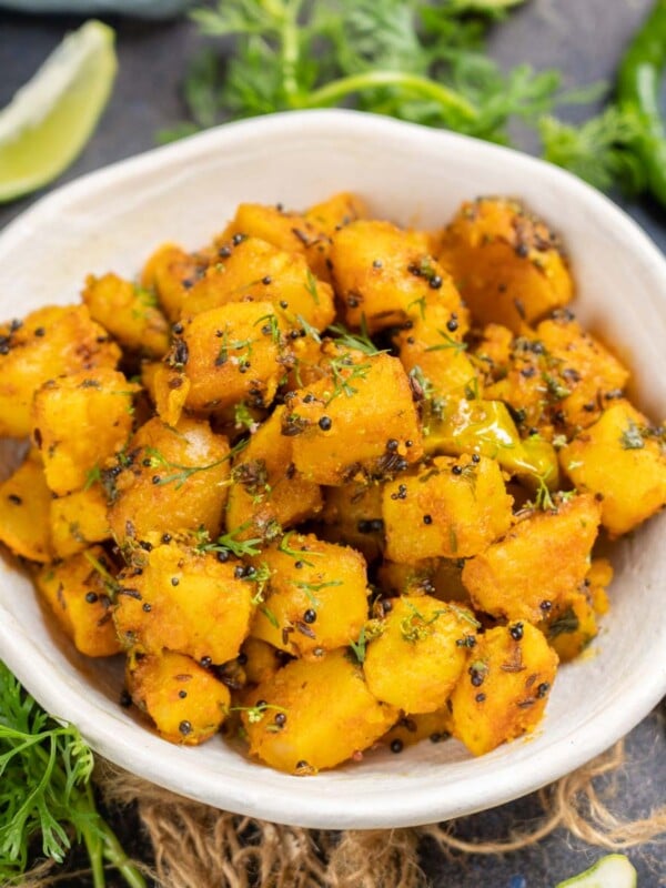 Aloo Ke Gutke is a traditional snack or side dish from the state of Uttarakhand in India. It is basically potato cubes cooked with spices. Here is how to make it (vegan, gluten-free).