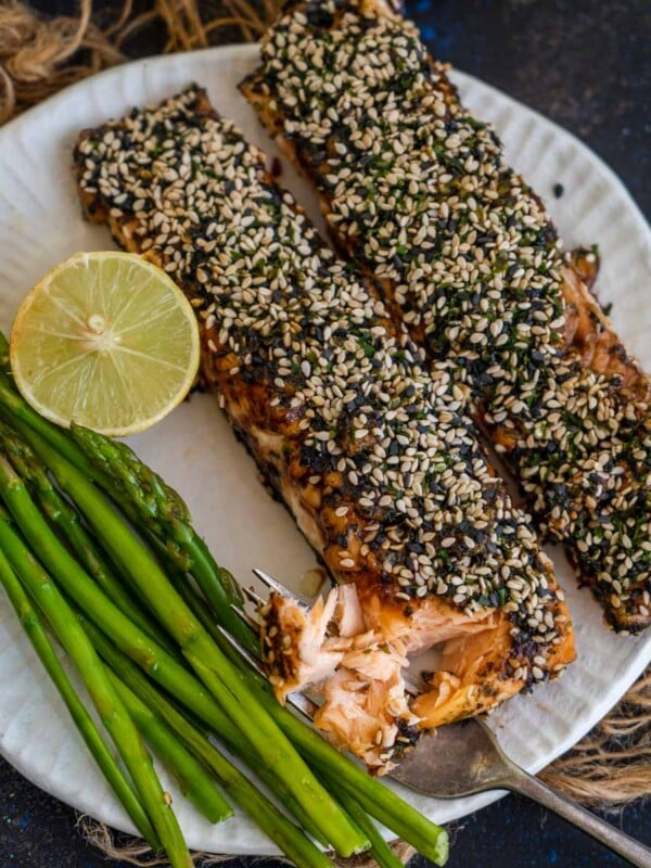Furikake Salmon is a delicious and healthy recipe where Salmon fillets are coated with a layer of Furikake seasoning and baked or air fried until cooked to perfection. Serve it with rice or wrap in nori sheets with rice to make sushi rolls. Here is how to make it.