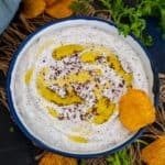 Sumac Labneh is a Middle Eastern dip made using thick yogurt and ground sumac. It is super healthy and comes together in 5 minutes of active working time.