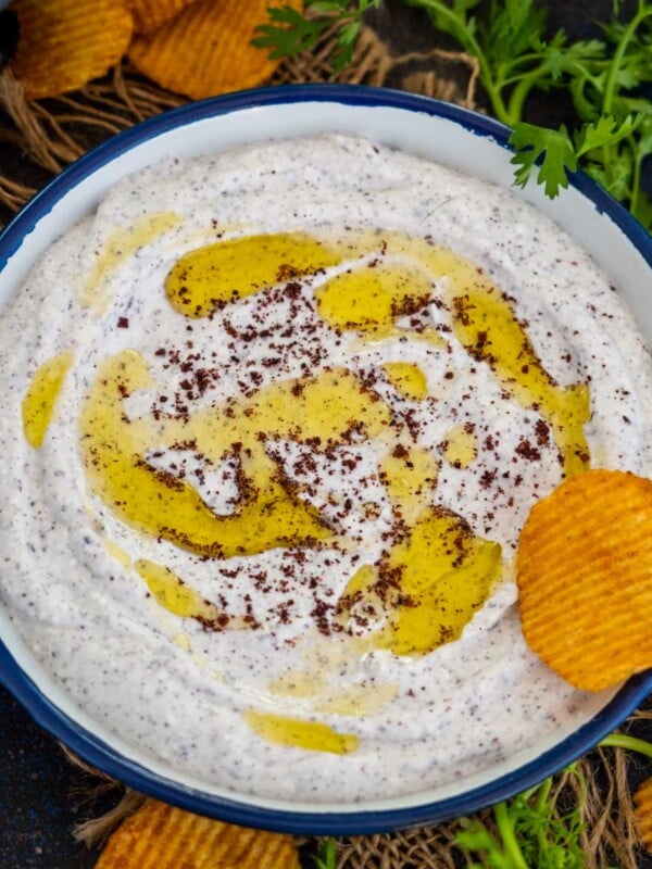Sumac Labneh is a Middle Eastern dip made using thick yogurt and ground sumac. It is super healthy and comes together in 5 minutes of active working time.