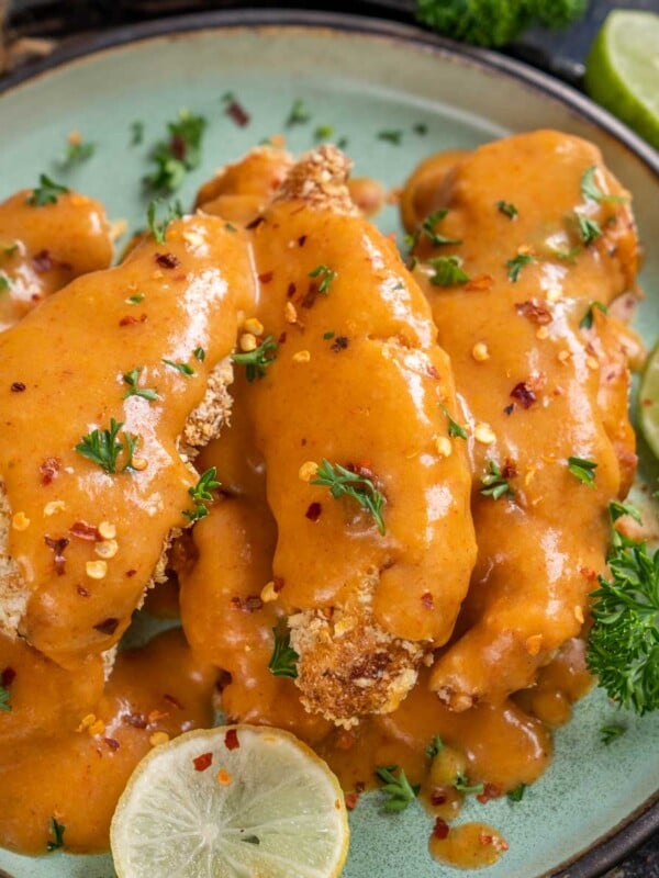 Lemon Pepper Chicken Tenders is a delicious appetizer where lemony zesty chicken is coated with a crunchy coating and topped with a creamy citrusy sauce. It comes together in under 40 minutes using a few simple ingredients. Make it in an air fryer using my easy recipe.