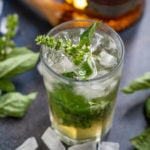 Basil Julep is a refreshing cocktail made using basil and whiskey. It is a take on the classic mint julep. Make it using my easy recipe.