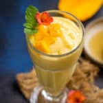 Mango magic tropical smoothie served in a glass.
