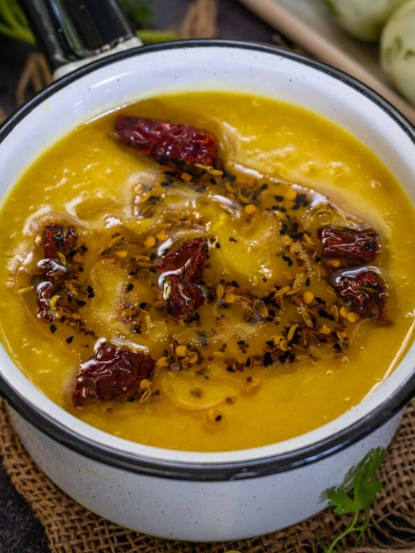 Tok Dal (Kancha Aamer Diye Tok Dal, Toker Dal) is a Bengali dish in which lentils are cooked with green mangoes. Make it using my easy recipe.
