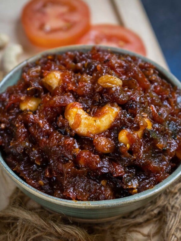 Tomato Khejur Chutney (Tomato and Date Chutney) is a quintessential Bengali condiment that is prepared in all Bengali homes for special occasions, festivals, or everyday meals. Make it using my easy recipe.