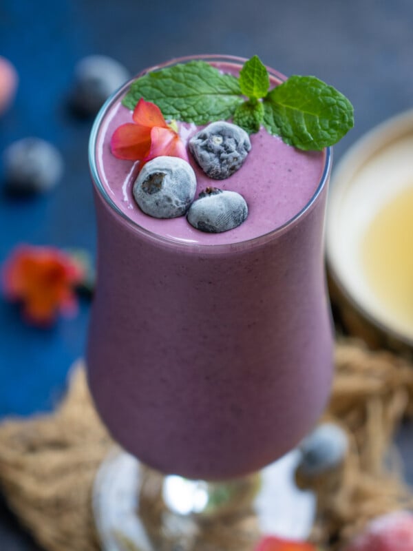 Triple Berry Oat Tropical Smoothie is a refreshing smoothie loaded with berries. Make it for breakfast, evening snack or pre or post work out snack.