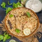 Make this delicious one-pot Tamil-Nadu Style Ambur Chicken Biryani at home using my easy recipe.