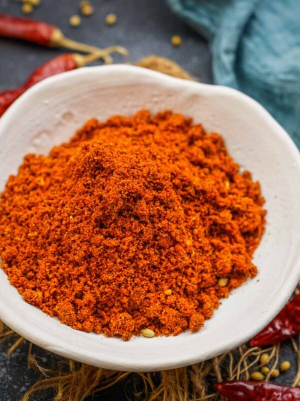 Dabeli Masala Powder is a spice mix that is used for making the popular Gujarati snack Kutchi Dabeli. Made using basic ingredients, this masala mix takes the Dabeli to the next level. Here is how to make it at home (vegan, gluten-free).