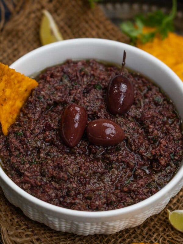 Kalamata Olive Tapenade is an easy and quick to make Mediterranean dip made with Kalamata olives, capers, parsley, and extra virgin olive oil (vegan, gluten-free).