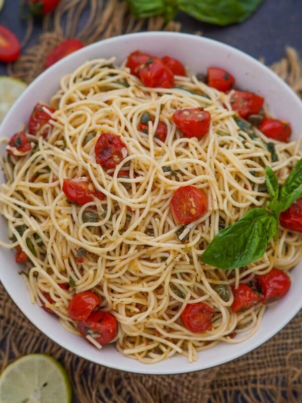 Lemon Capellini Salad (With Tomatoes And Capers) is a light pasta salad that is super easy to make using minimal ingredients. Serve it hot or cold.