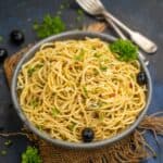 Olive Tapenade Pasta is a quick pasta recipe made using spaghetti, olive tapenade and a few more simple pantry ingredients. Serve it with garlic bread for a hearty meal (vegetarian).