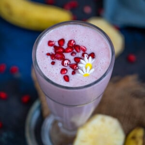 Pomegranate Plunge Tropical Smoothie is a healthy and delicious smoothie loaded with tropical flavors. Enjoy it for breakfast or mid-day snack. (gluten-free, can be easily made vegan)