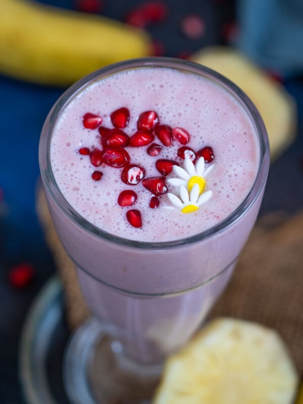 Pomegranate Plunge Tropical Smoothie is a healthy and delicious smoothie loaded with tropical flavors. Enjoy it for breakfast or mid-day snack. (gluten-free, can be easily made vegan)