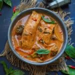 Salmon Panang Curry served in a bowl.