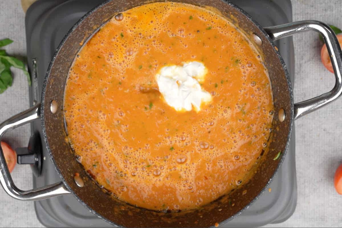Heavy cream and sugar added to the pan.