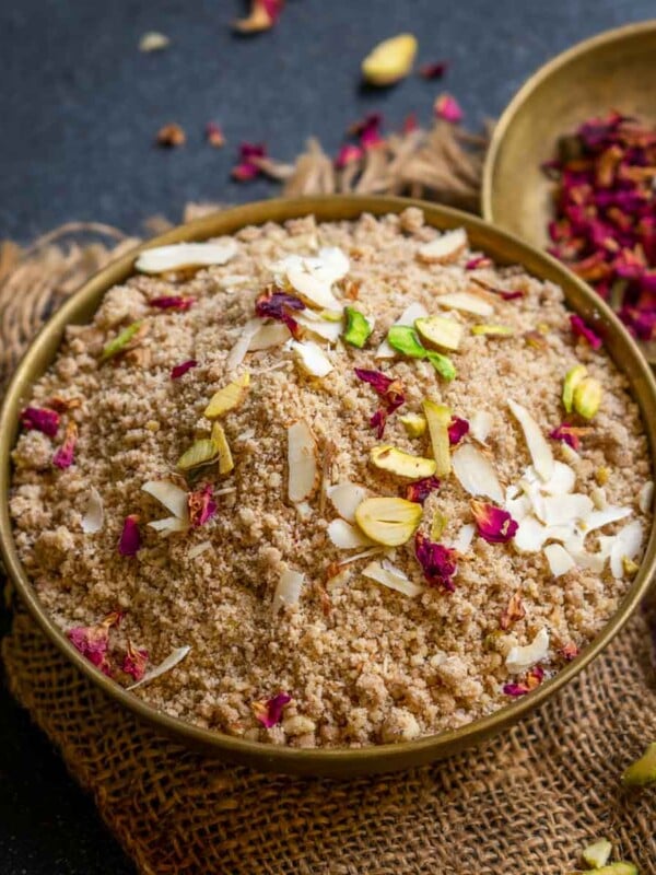 Badam Panjiri (Almond Panjiri) is a North Indian sweet dish prepared with almond flour, ghee, powdered sugar, and nuts. It is a slight variation of the classic panjiri that is made using wholewheat flour. Make it using my easy recipe (vegetarian, gluten-free).