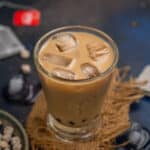 Chai tea boba served in a glass.