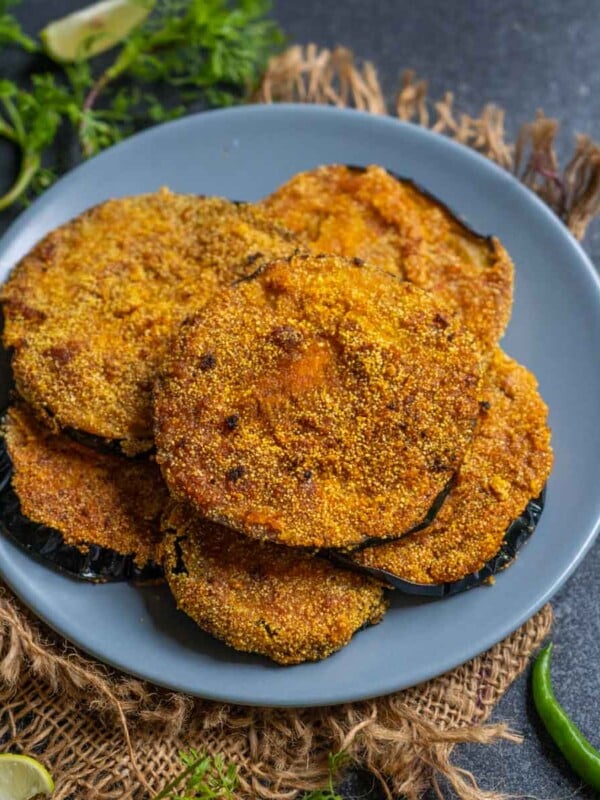 Vangyache Kaap (Maharashtrian Pan Fried Crispy Eggplants) is a traditional Maharashtrian dish prepared with large purple eggplants (brinjals). Serve it with Varan Bhaat or Khichdi. (vegan, can be made gluten-free)