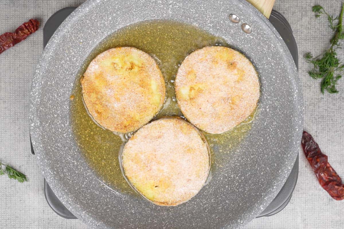 Frying the kaap in hot oil.