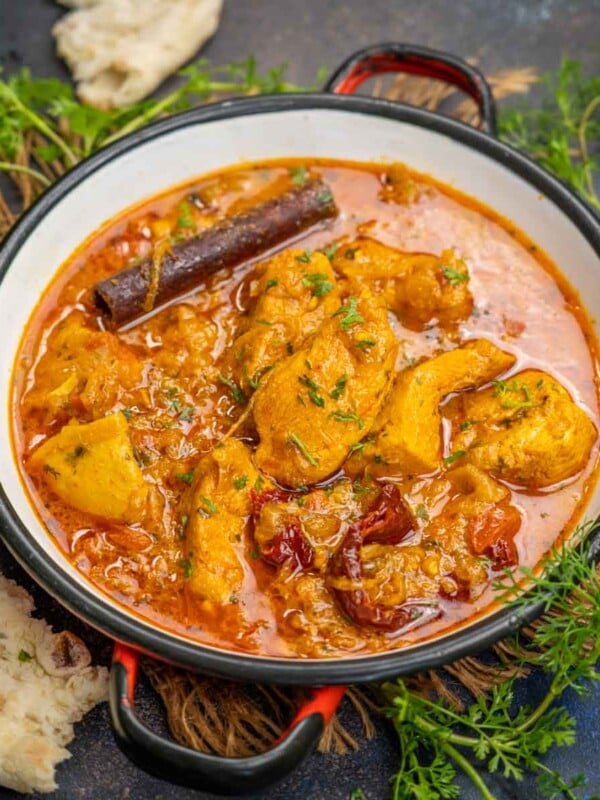 This spicy and flavorful North Indian-style Boneless Chicken Curry is easy to make using a few simple ingredients. You can make it in an instant pot or a traditional pressure cooker.