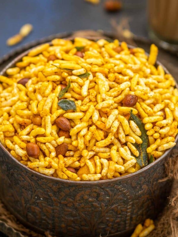 Murmura Namkeen is a sweet spicy mixture prepared with murmura (puffed rice), nuts, curry leaves, and spices. Serve it with a hot cup of tea or coffee (vegan, can be easily made gluten-free).