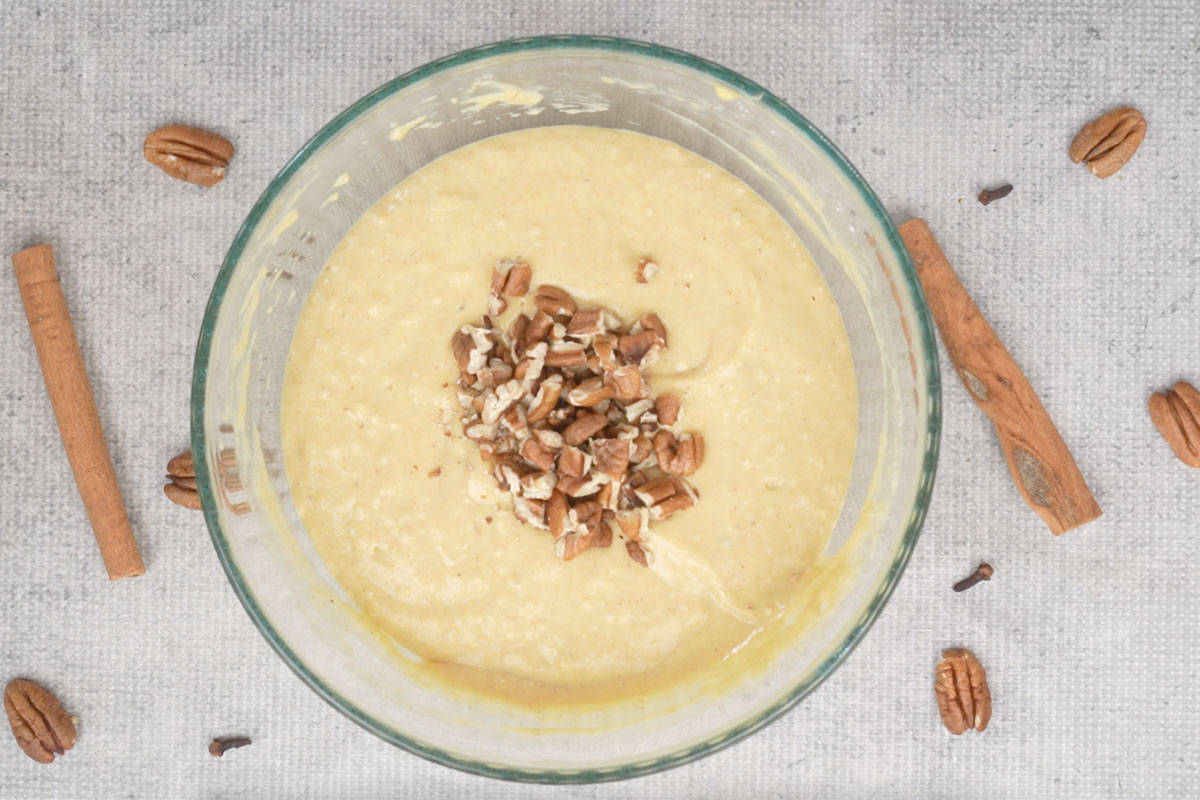 Chopped pecans added to the bowl.