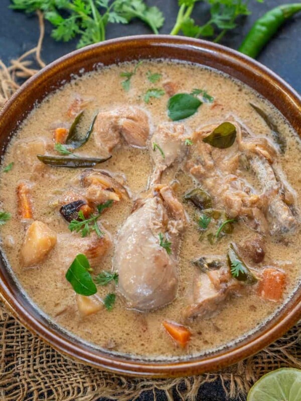 Kerala Chicken Stew is a traditional dish from Kerala (India). It is a mild chicken curry prepared using bone-in chicken, veggies, spices, and coconut milk. Make it using my easy recipe and serve it with steamed rice, appam, or hoppers.