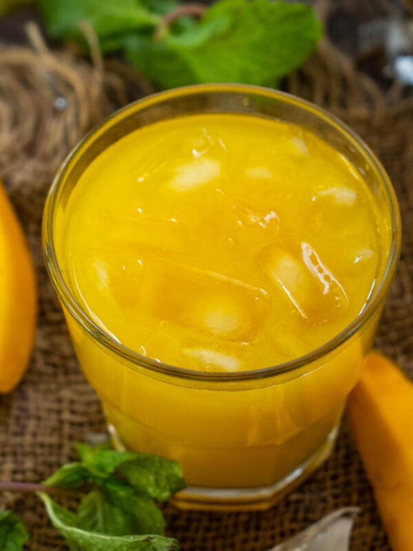 Make Mango Frooti (a popular sweet and tangy Indian mango drink) at home using my easy recipe. It tastes just like the store-bought one, minus the harmful colors and preservatives.