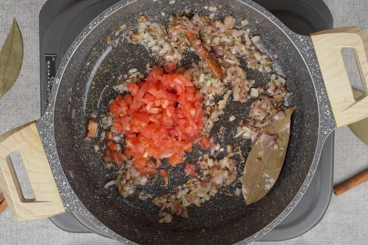 Tomatoes added to the pan.