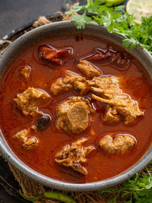 Lamb Rogan Josh is a Kashmiri-style curry where lamb pieces are cooked in a fennel and dry ginger flavored curry. Make it using my easy recipe.