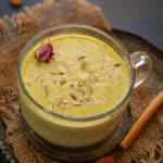 Masala milk served in a cup.