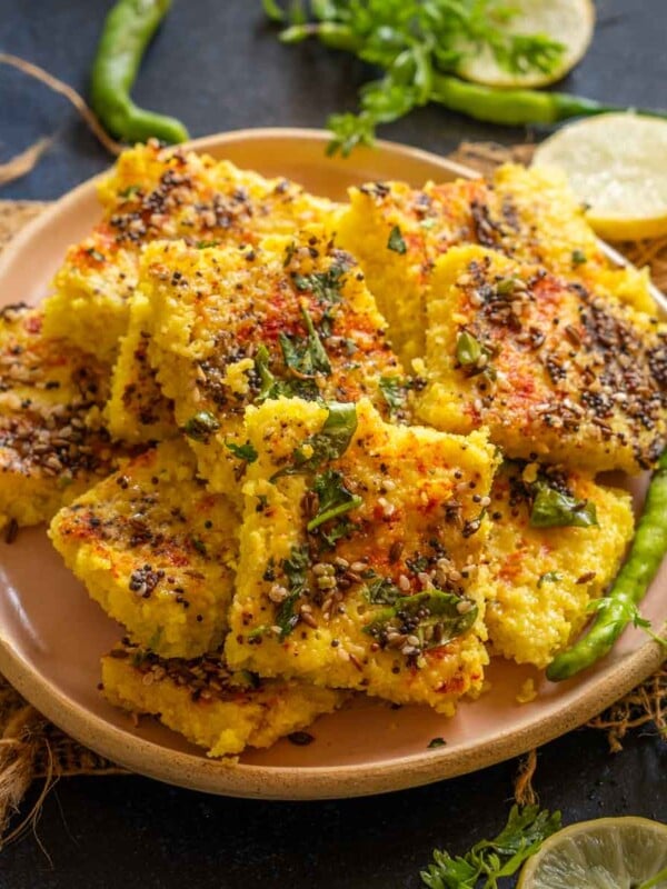 Poha Dhokla is an instant version of Gujarat's popular farsaan, Dhokla. It is best enjoyed with green chutney, fried chilies, and masala chai. Here is a simple step-by-step recipe to make it (vegetarian).
