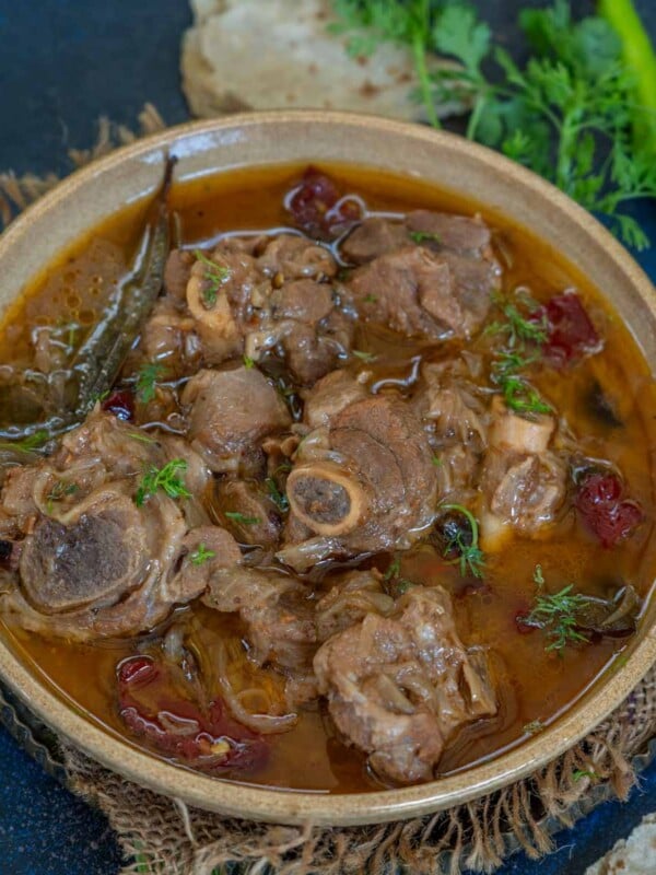 Try this Old Delhi-Style Mughlai Mutton Stew, which features mutton cooked with onion, yogurt, and whole spices. Serve it with tandoori roti or naan for a hearty meal.