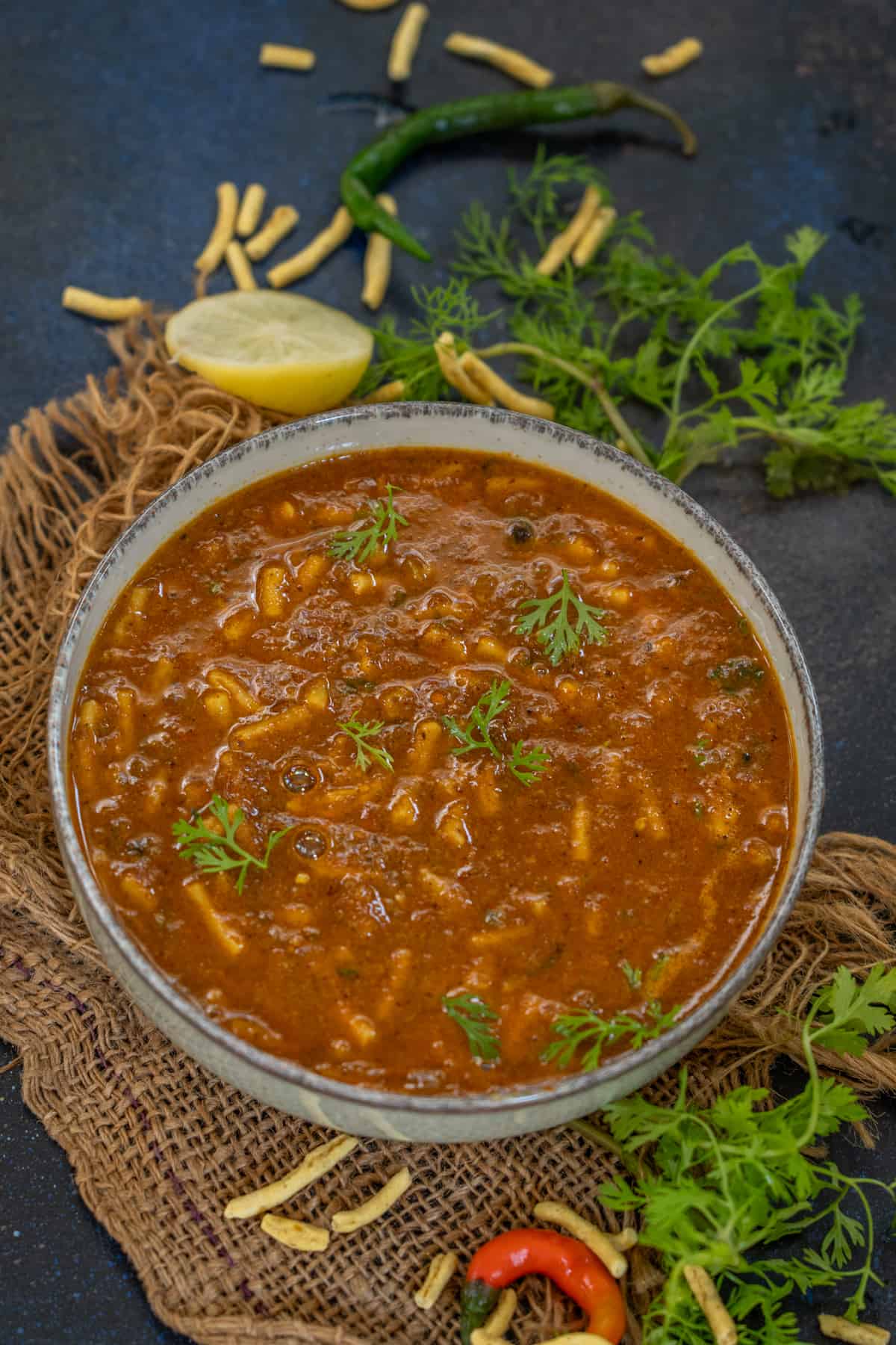 Shev bhaji served in a bowl.
