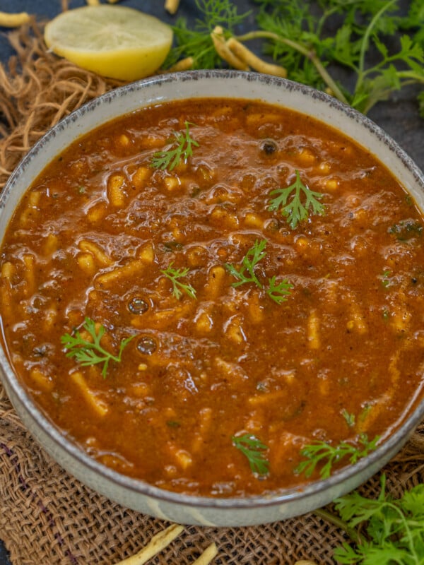 Shev Bhaji is a delicious Maharashtrian recipe in which thick sev are dunked in a spicy onion-coconut gravy. Try my easy recipe here.