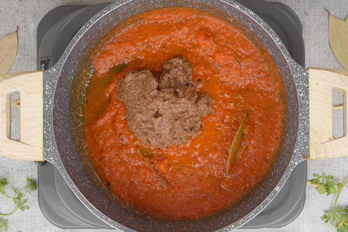 Masala paste and water added to the pan.