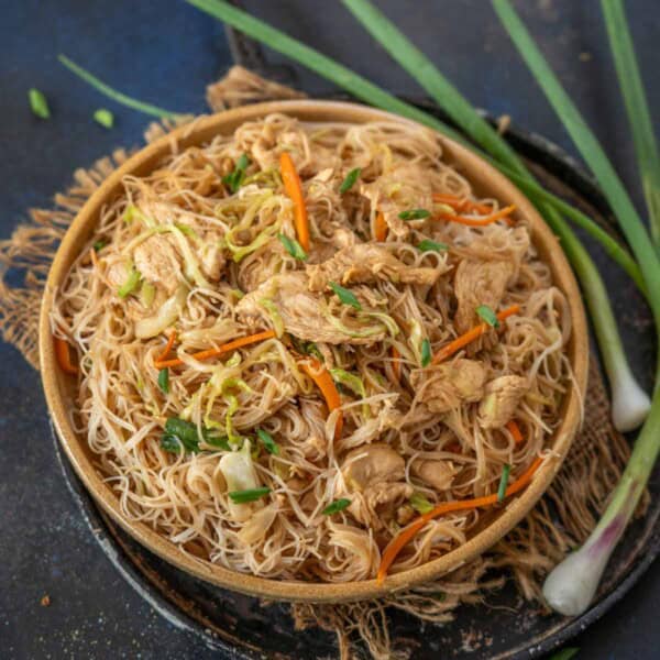 Chicken Mei Fun Noodles is an Asian stir-fry made with rice noodles, sauces, veggies, and boneless chicken. Make it using my easy recipe.