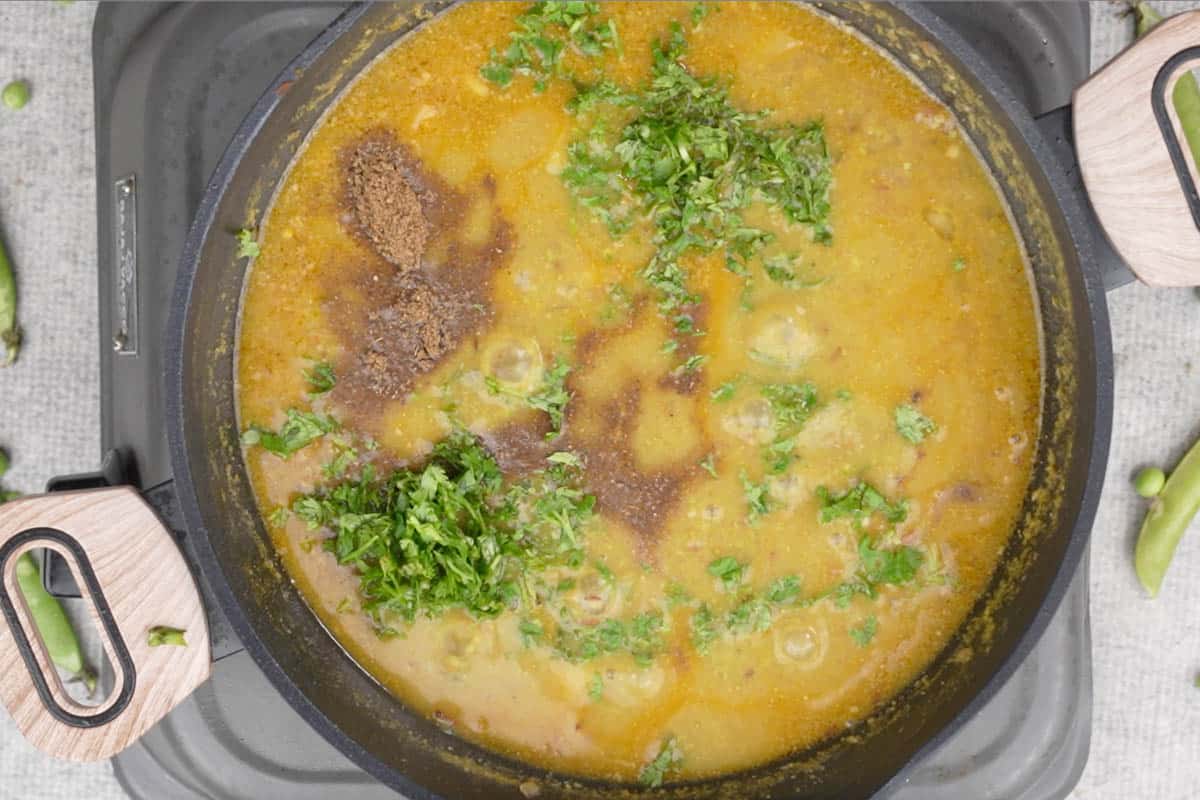 Garam masala, lime juice and cilantro added to the pan.