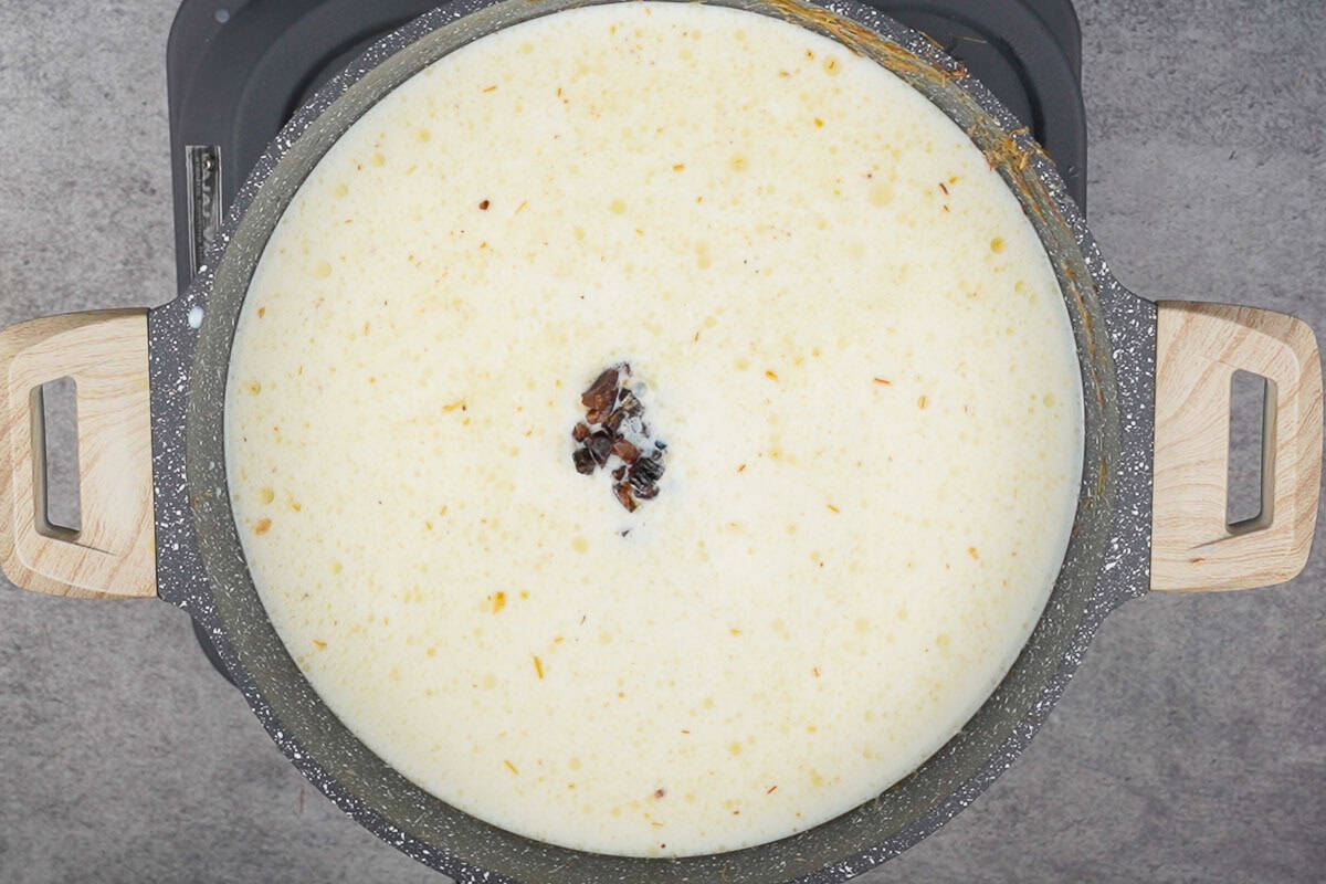 Milk and dates added to the pan.