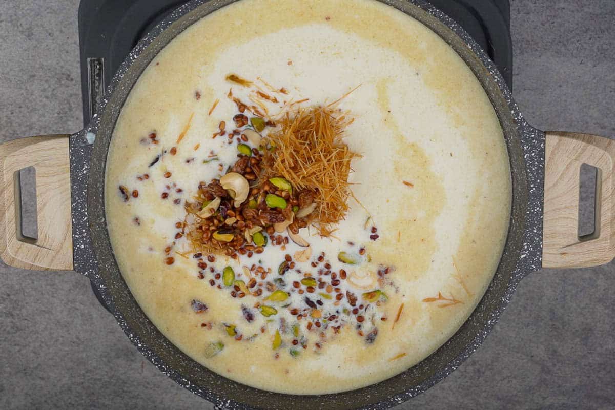 Roasted vermicelli and roasted nuts added to the pan.