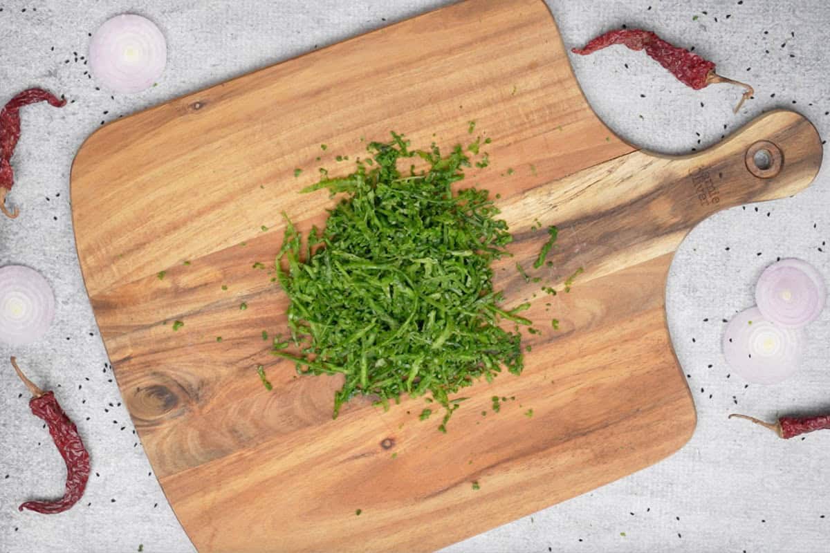 Karela peel kept on a chopping board.