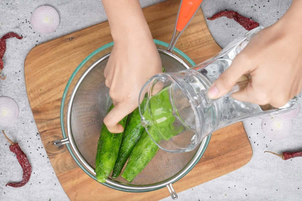 Washing the karela with water.