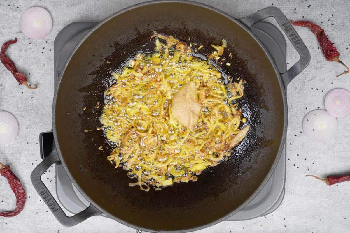 Ginger garlic paste added to the pan.