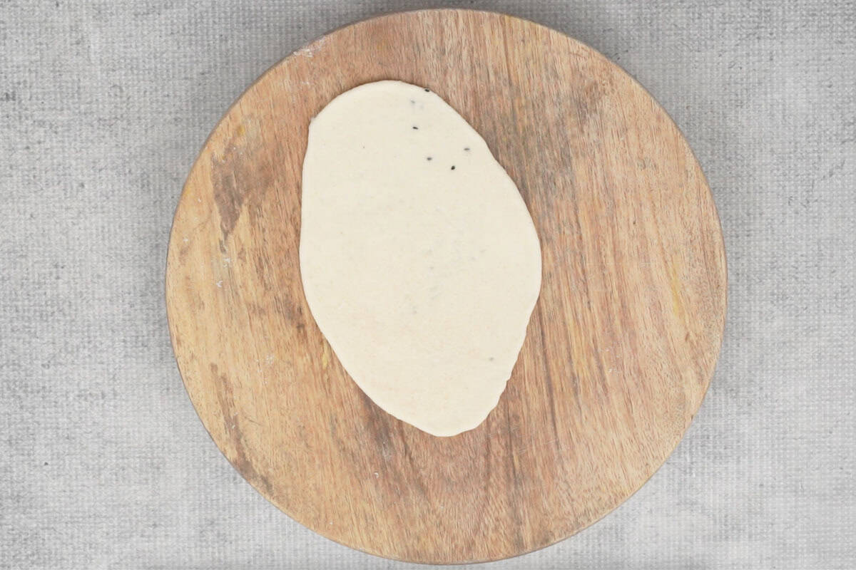 Rolled into an oval.