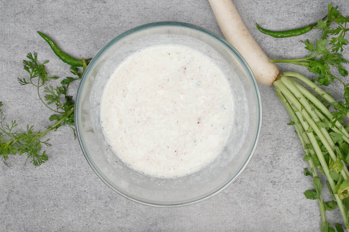 Mooli ka raita in a bowl.